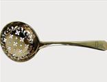 A silver gilt old english sifter