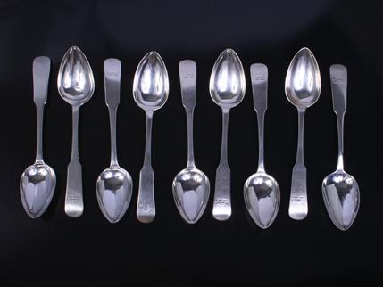 Nine George III Scottish fiddle pattern sterling silver dessert spoons
