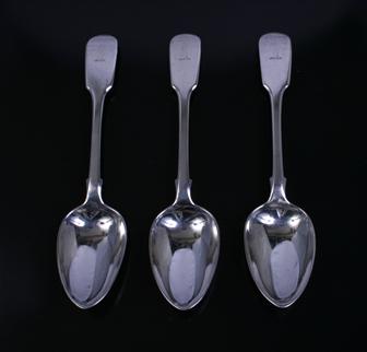 Three William IV fiddle pattern sterling silver dessert spoons