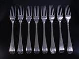 Eight Georgian silver table forks
