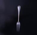 An Edwardian Old English bead edge pattern sterling silver table fork