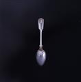 MILITARY: A Victorian fiddle, thread and shell pattern silver teaspoon