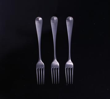 Three George V Hanoverian pattern sterling silver table forks