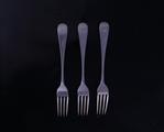Three George V Hanoverian pattern sterling silver table forks