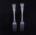 Two George IV silver table forks