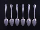 A set of six George III  Old English pattern sterling silver dessert spoons