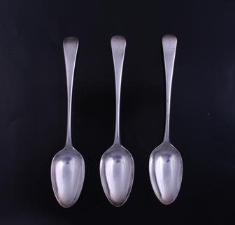 A set of three George III Old English pattern sterling silver table spoons