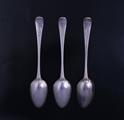 A set of three George III Old English pattern sterling silver table spoons