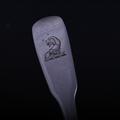 A George III sterling silver fiddle pattern teaspoon