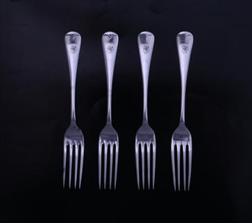 Four George V Old English pattern sterling silver dessert forks