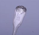 A pair of Victorian sterling silver fiddle thread and shell dessert spoons