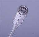 A pair of Victorian sterling silver fiddle thread and shell dessert spoons
