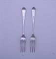 A pair of Victorian Old English dognose pattern sterling silver dessert forks