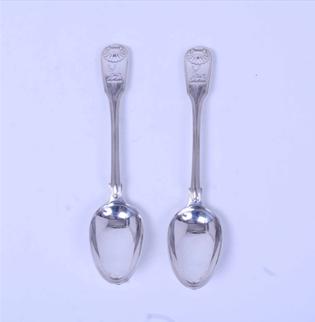 A pair of George IV sterling silver fiddle, thread and shell pattern table spoons