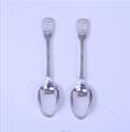 A pair of George IV sterling silver fiddle, thread and shell pattern table spoons