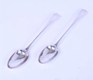 A pair of George III sterling silver serving spoons