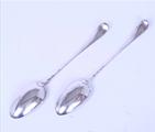 A pair of George III sterling silver serving spoons
