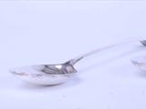 A pair of George III sterling silver serving spoons