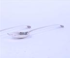 A pair of George III sterling silver serving spoons