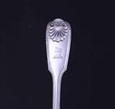 A Victorian fiddle, thread and shell pattern sterling silver table fork