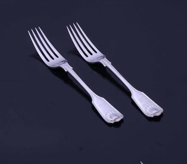 A pair of Victorian sterling silver fiddle, thread and shell pattern table forks