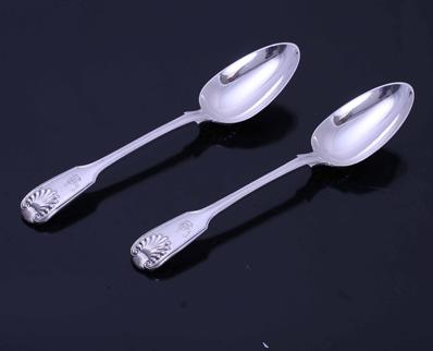 A pair of Victorian fiddle, thread and shell pattern sterling silver table spoons