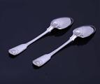 A pair of Victorian fiddle, thread and shell pattern sterling silver table spoons