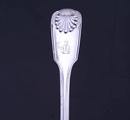 A pair of Victorian fiddle, thread and shell pattern sterling silver table spoons