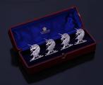 Set of Victorian armorial sterling silver place card holders