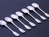 Set of seven Edwardian fiddle, thread and shell pattern sterling silver table spoons