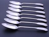 Set of seven Edwardian fiddle, thread and shell pattern sterling silver table spoons