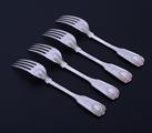 Set of four Victorian fiddle, thread and shell pattern sterling silver dessert forks