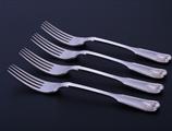 Set of four Victorian fiddle, thread and shell pattern sterling silver dessert forks