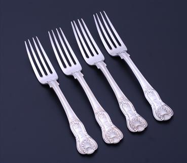 A set of four George IV King's pattern sterling silver dessert forks