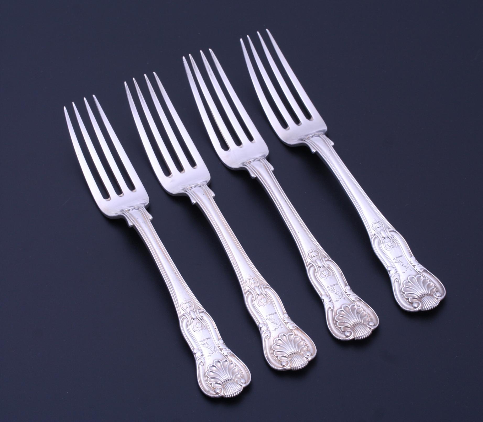 A set of four IV King's pattern sterling silver dessert forks