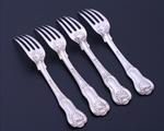 A set of four George IV King's pattern sterling silver dessert forks