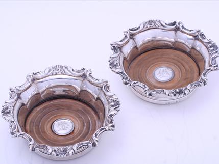 A pair of William IV sterling silver wine coasters