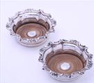 A pair of William IV sterling silver wine coasters