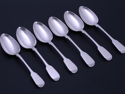 A set of six William IV sterling silver fiddle pattern table spoons