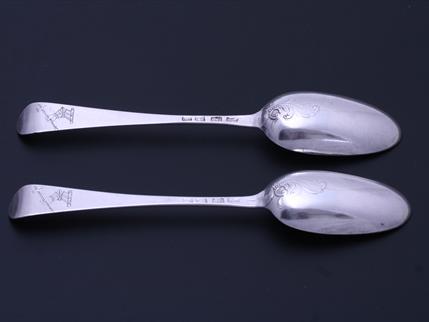 A rare pair of George III sterling silver Hanoverian pattern scrollback spoons