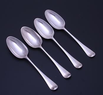 A set of four George III sterling silver table spoons