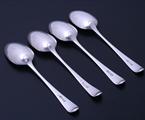 Set of four George III Old English pattern sterling silver table spoons