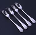 A set of four Edwardian Old English pattern sterling silver forks