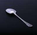 A George IV sterling silver feather edge table spoon