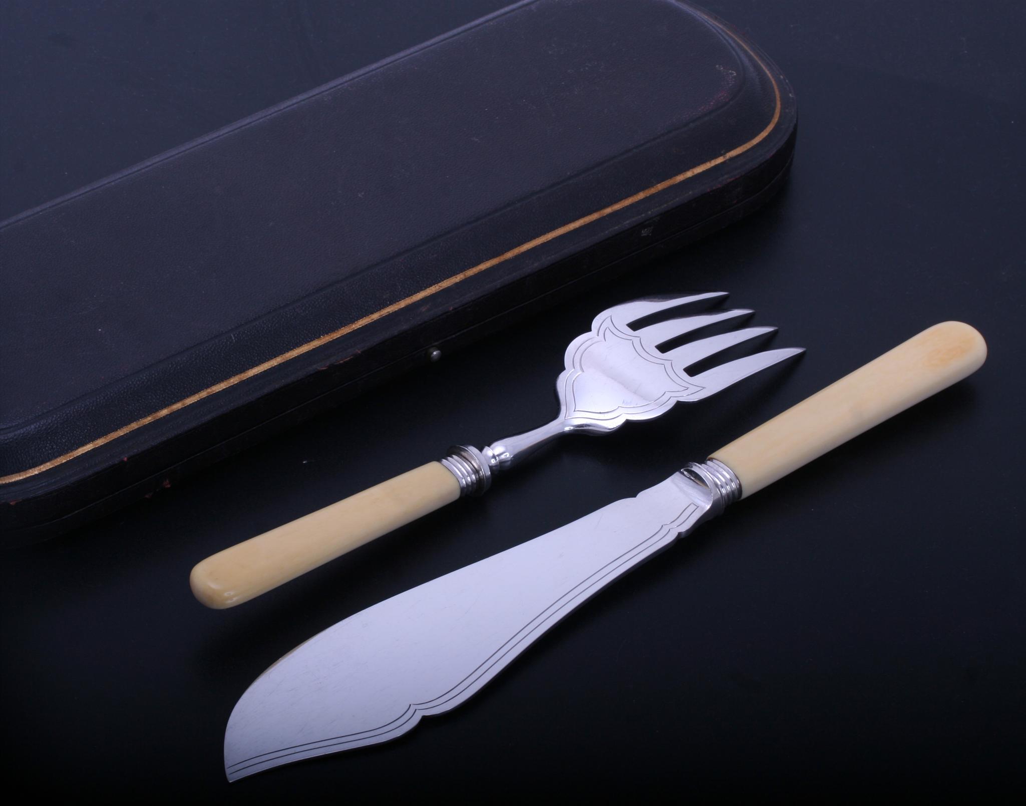 A pair of Victorian sterling silver fish servers