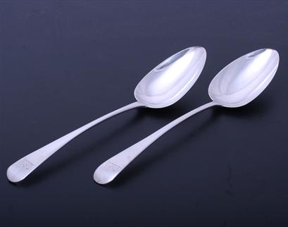 A matched pair of George III sterling silver Old English pattern table spoons
