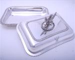 Pair Regency sterling silver entree dishes with armorial finials