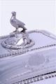 A William IV sterling silver entree dish and cover with armorial finial on electroplate two handled stand