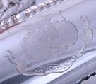 A William IV sterling silver entree dish and cover with armorial finial on electroplate two handled stand