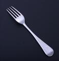 A George III sterling silver Old English pattern table fork